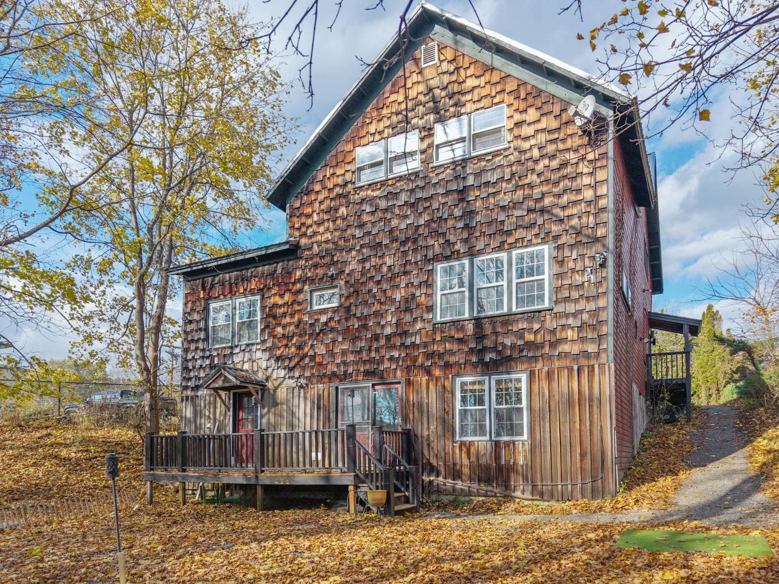 Rear exterior & fenced yard at 17 Walnut St, Cooperstown NY